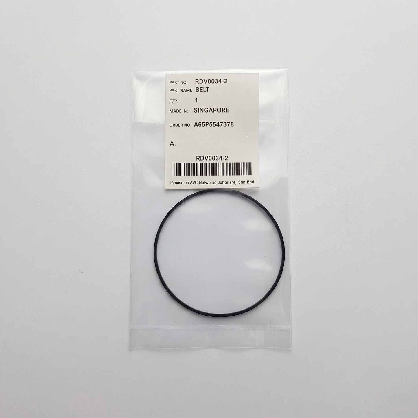 A black rubber belt enclosed in a clear plastic bag with a white label. The label shows the text 'PART NAME: BELT' and 'Panasonic AIC Network Drive Belt' along with a barcode and part number RDSW0014-2.