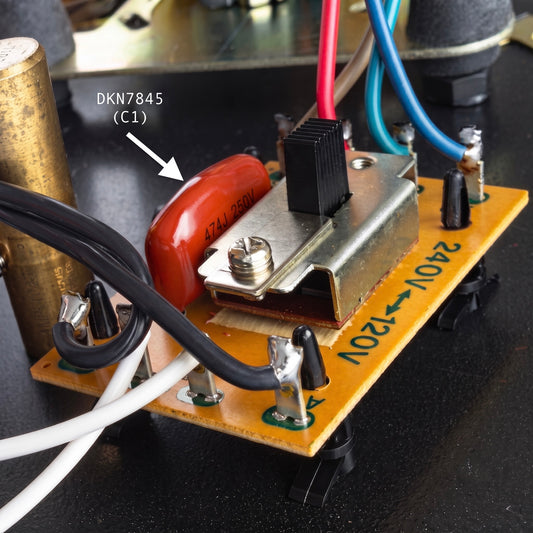 Close-up of a Pioneer PL-12D / PL-12E turntable motor repair PCB featuring a replacement 0.047uF (47nF) C1 capacitor marked 474J 250V, situated next to a 240V to 120V voltage selector switch with white, black, red, and blue wiring.