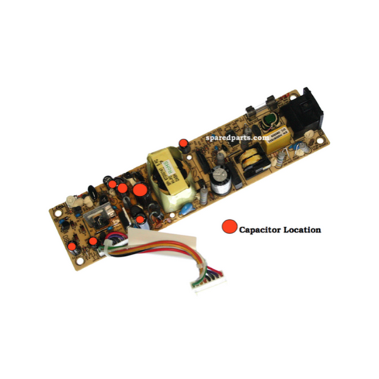 Electronic circuit board with labeled capacitor location on a white background