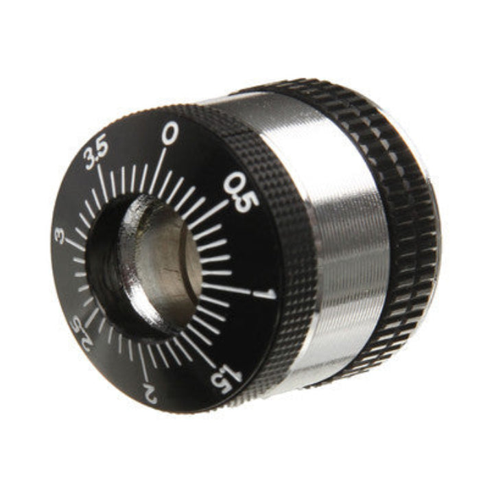 A Technics counter balance weight for a turntable, with black and silver colors, featuring balance weight markings.