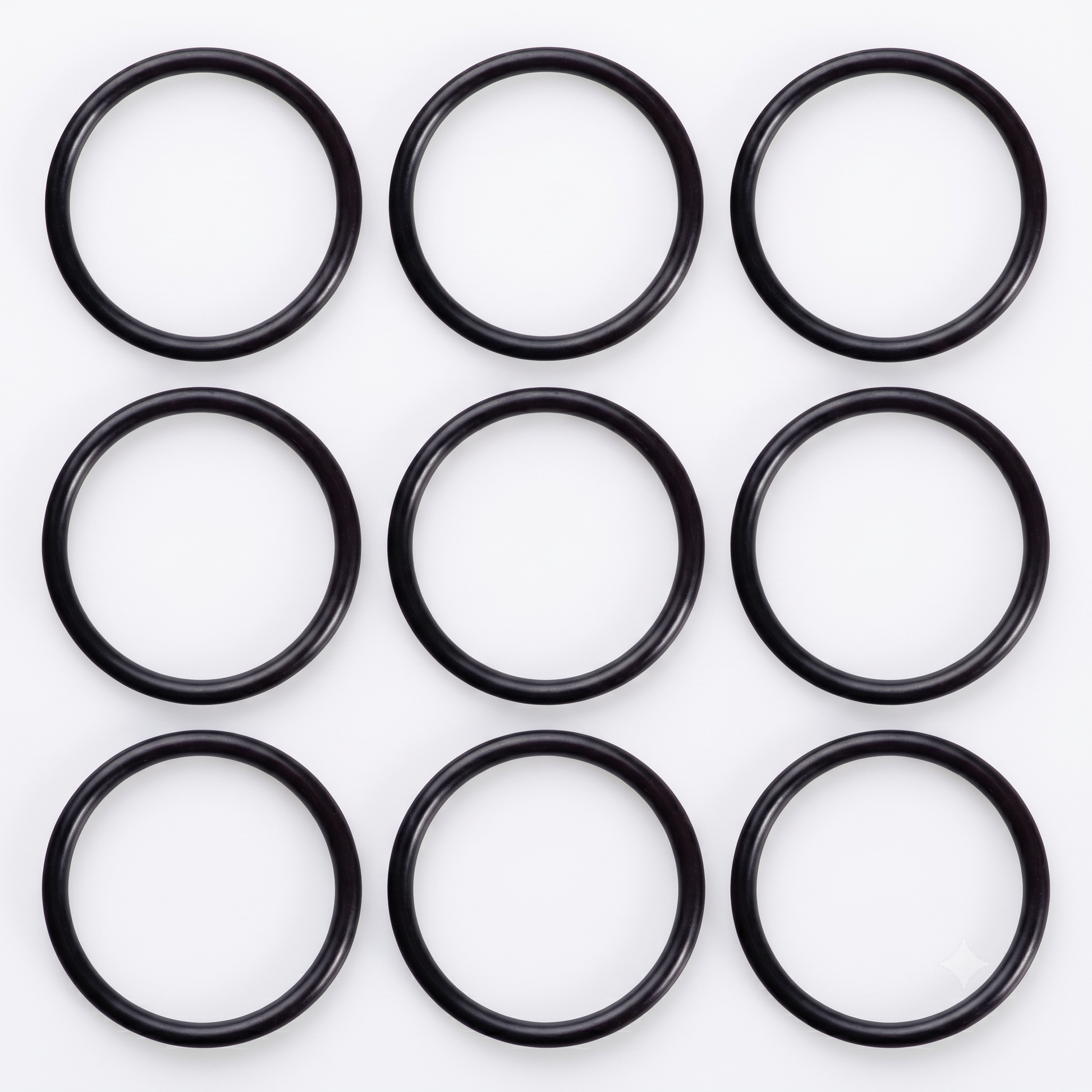 A neat 3 x 3 grid arrangement of nine black rubber Hansgrohe 98066000 replacement O-ring seals, showcasing the spare plug washers for Flexaplus and Exafill bath wastes on a bright white background.