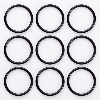 A neat 3 x 3 grid arrangement of nine black rubber Hansgrohe 98066000 replacement O-ring seals, showcasing the spare plug washers for Flexaplus and Exafill bath wastes on a bright white background.