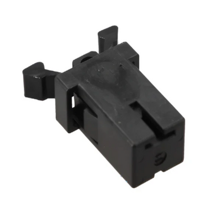 Black plastic component on a white background