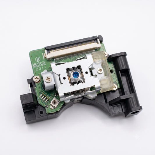 A replacement laser scanner or DVD player internal component with a green circuit board, silver metal mirror, and black plastic housing, shown on a white background.