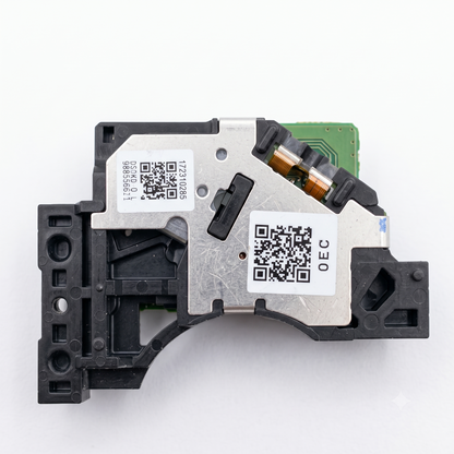 An optical laser pickup head assembly featuring a central glass lens, electronic circuit board, ribbon cable connector, and metallic casing, isolated on a solid white background.