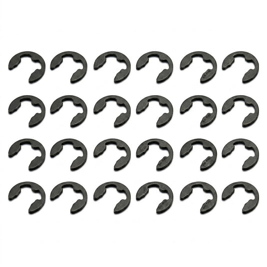A high-resolution product photograph showing twenty-four black steel E-clips (retaining rings) neatly arranged in a grid pattern. The grid consists of four horizontal rows, each containing six identical clips oriented in the same direction. The clips are set against a crisp, solid white background, with faint, subtle shadows beneath each clip giving them a sense of depth.