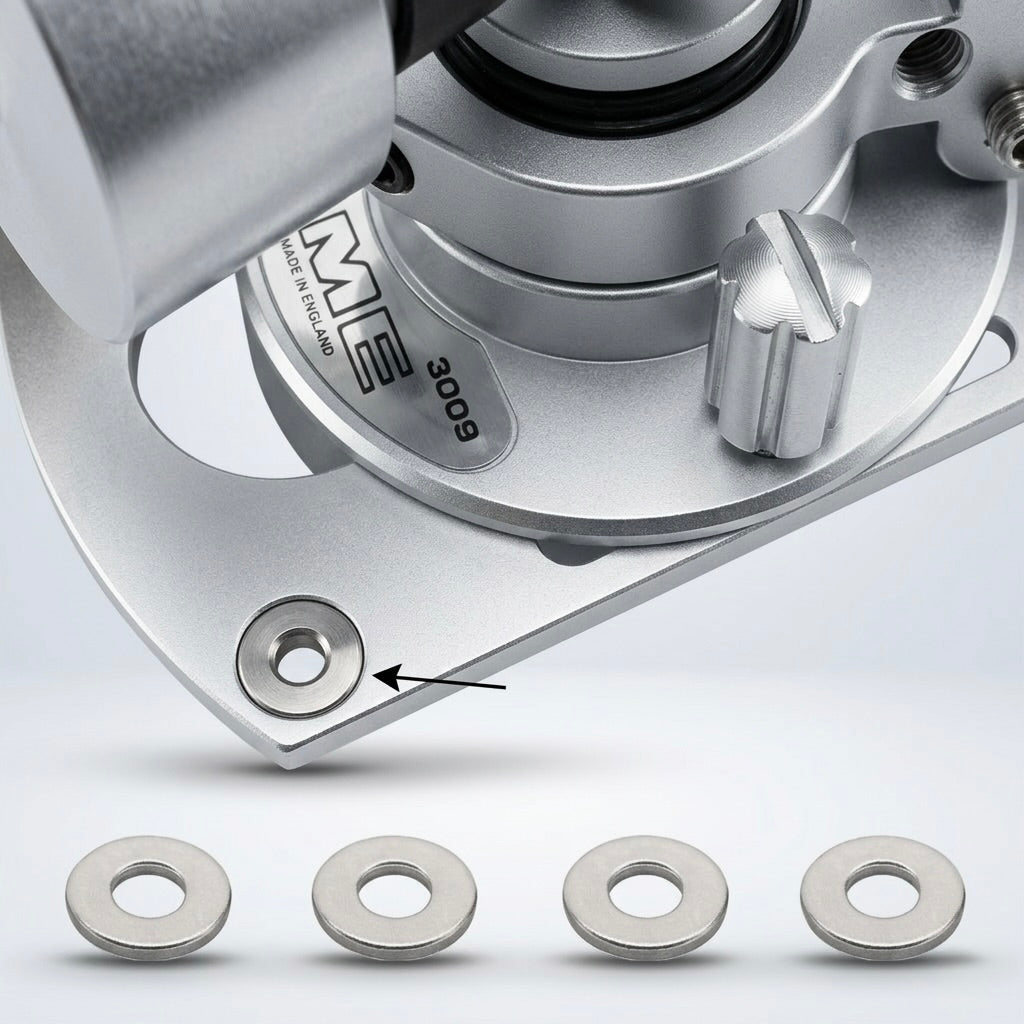 Product diagram of an SME 3009 tonearm bedplate, showing a metallic coloured base with an arrow pointing to a circular recess labeled "Insert Washer x 4". Below the tonearm assembly, a row of four flat, metallic silver washers is displayed side-by-side against a white background with soft drop shadows.