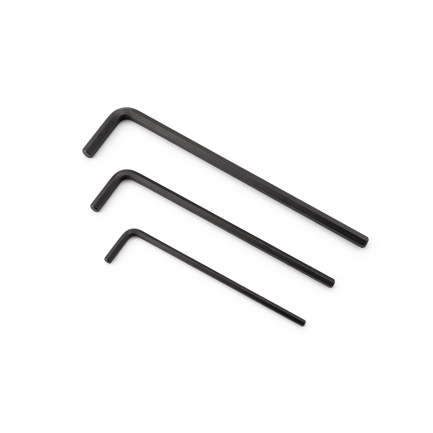 Three black hex wrenches of different sizes arranged diagonally on a plain white background.