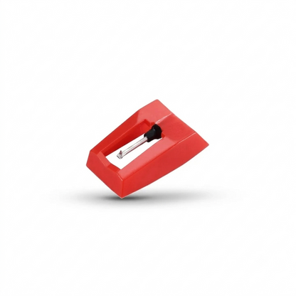 A studio product shot of a bright red plastic turntable stylus (needle) assembly, showing the metal cantilever and diamond tip pointing downward, floating slightly with a soft shadow on a solid white background.