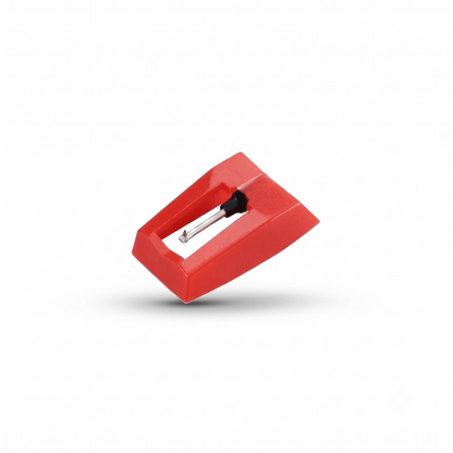 A studio product shot of a bright red plastic turntable stylus (needle) assembly, showing the metal cantilever and diamond tip pointing downward, floating slightly with a soft shadow on a solid white background.