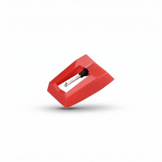 A studio product shot of a bright red plastic turntable stylus (needle) assembly, showing the metal cantilever and diamond tip pointing downward, floating slightly with a soft shadow on a solid white background.