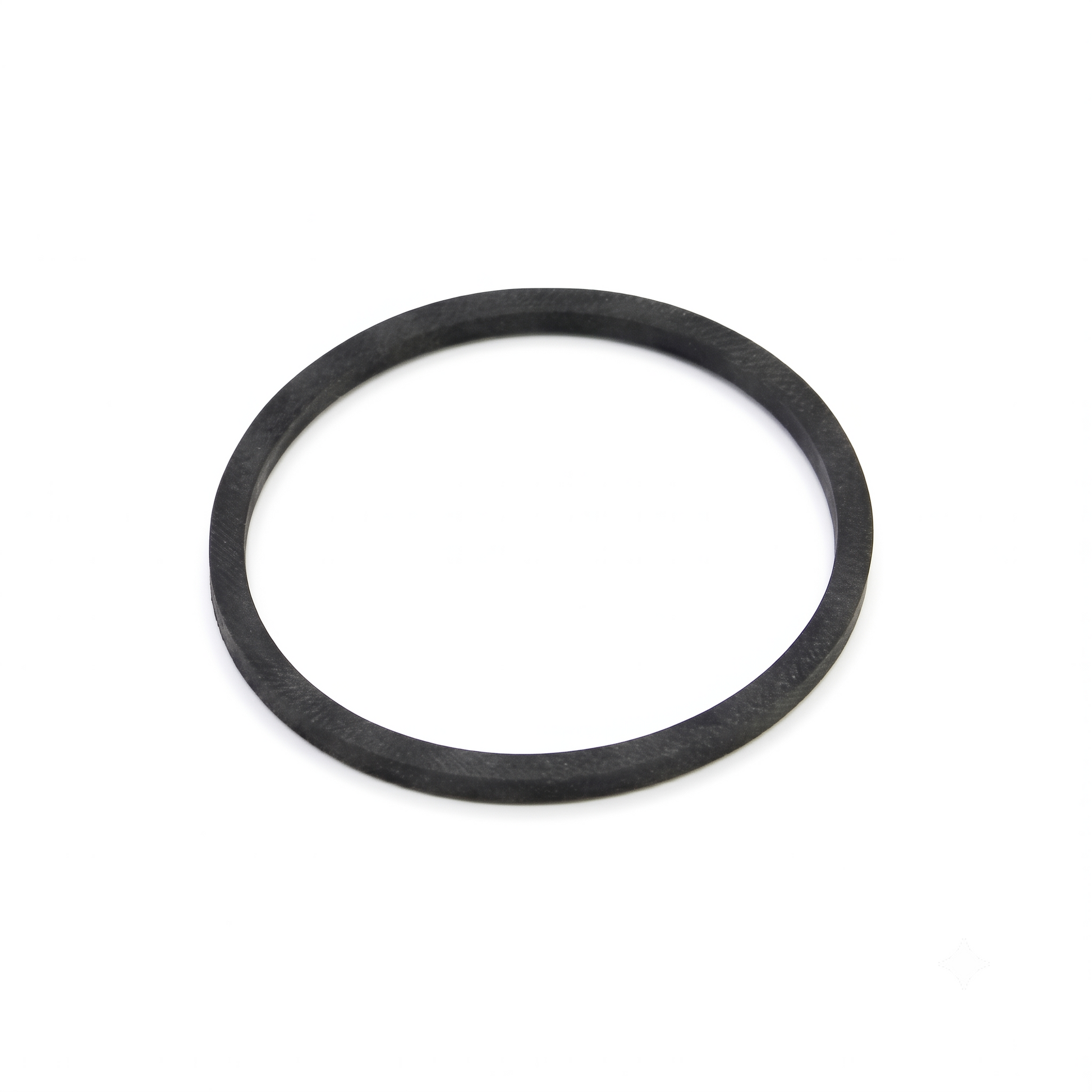 A black rubber square-cut drive belt, forming a clean circle, resting flat on a seamless white surface with soft shadowing underneath.