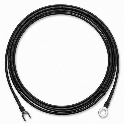 A top-down, studio shot of a black external earthing wire for a Linn LP-12 turntable, coiled into a perfect circle against a clean white background.The wire features different terminals at each end: the bottom-left end terminates in a silver metal fork (spade) connector, while the bottom-right end terminates in a silver metal ring connector. Both connections are neatly sealed with black heat-shrink tubing.