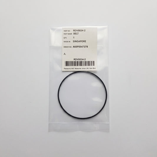 A black rubber belt enclosed in a clear plastic bag with a white label. The label shows the text 'PART NAME: BELT' and 'Panasonic AIC Network Drive Belt' along with a barcode and part number RDSW0014-2.