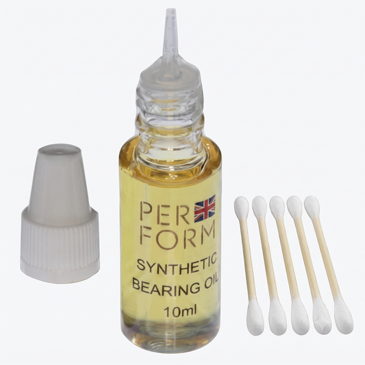 A 10ml bottle of PERFORM Synthetic Bearing Oil with its white cap removed and placed beside it, alongside five cotton swabs on a plain white background.