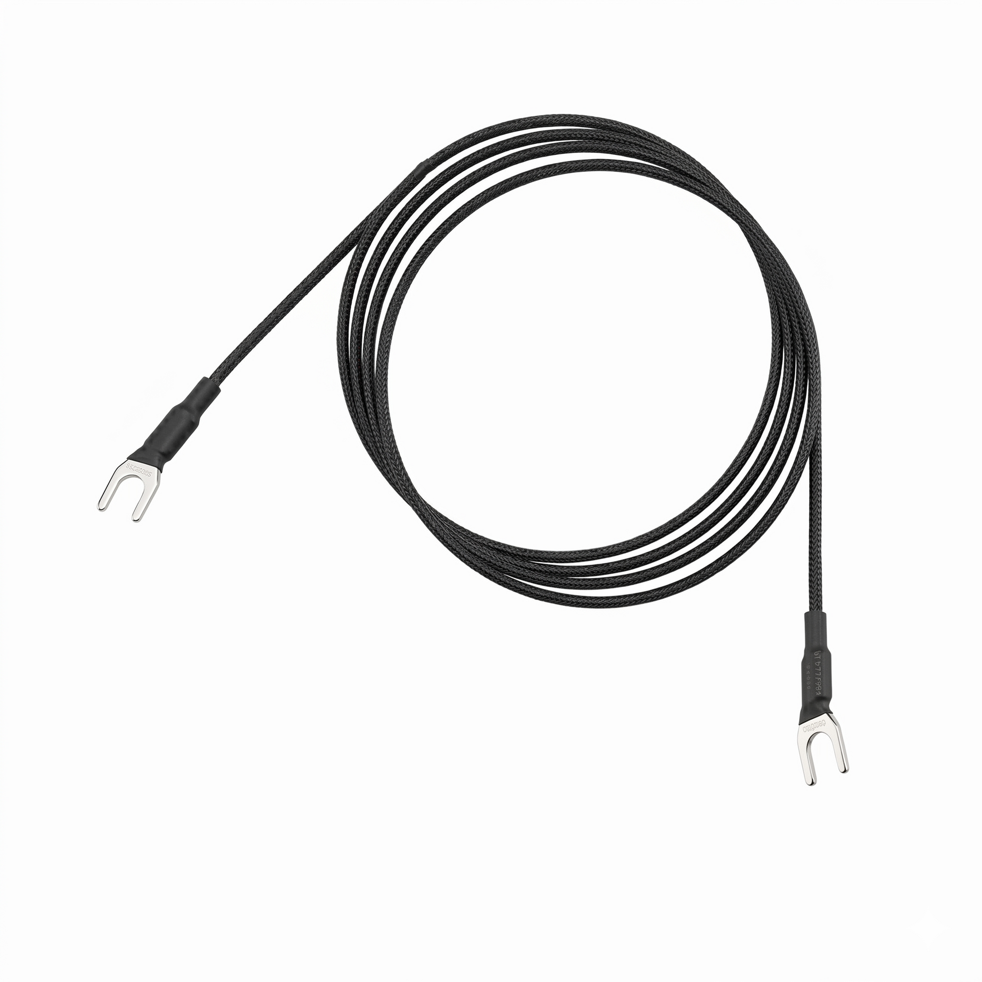 A Pro-Ject Connect it turntable earthing ground wire coiled into a neat circle against a plain white background. The black cable features a textured, braided sleeve and terminates at both ends with silver u-shaped spade connectors wrapped in black heat-shrink tubing.