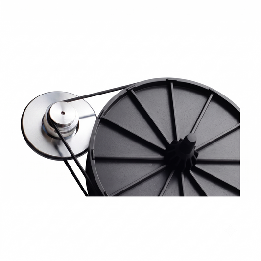 A high-definition, close-up studio shot demonstrating a black rubber Rega turntable drive belt installed on the inner mechanical components of a turntable. The thin black belt loops tightly around a polished silver aluminum motor pulley on the left and wraps around the edge of a large, matte black plastic sub-platter on the right. The sub-platter features structural spokes radiating from its central spindle. The entire assembly is cleanly isolated against a solid, bright white background.