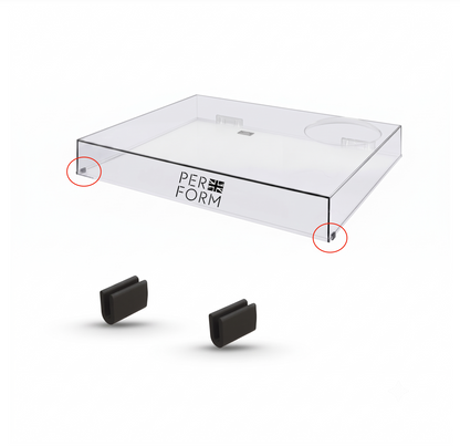 A clear acrylic display tray with the brand name 'PERFORM' printed on the side, shown above two small black accessory pieces on a white background. Red circles highlight the bottom corners of the tray.