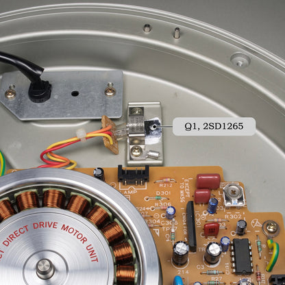 A black pointer line anchors to a flat, silver power transistor labeled Q1 that is screwed down onto a small metal bracket plate, which is attached to the silver turntable chassis. A floating white text box to the right reads "Q1, 2SD1265" to specify the component part number. Three coloured wires (yellow, orange, and red) extend from the left side of this transistor assembly down toward the main board.