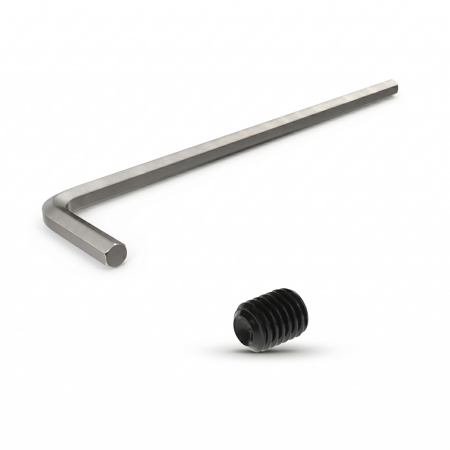Metal Allen wrench and black hex nut on a white background