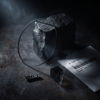 Sony belt set on a dark textured surface, featuring a metal SONY logo and a product card with a barcode.