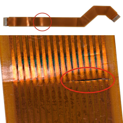 A close-up of a flexible copper trace PCB ribbon cable with two red circles highlighting damaged or broken traces on the ribbon.