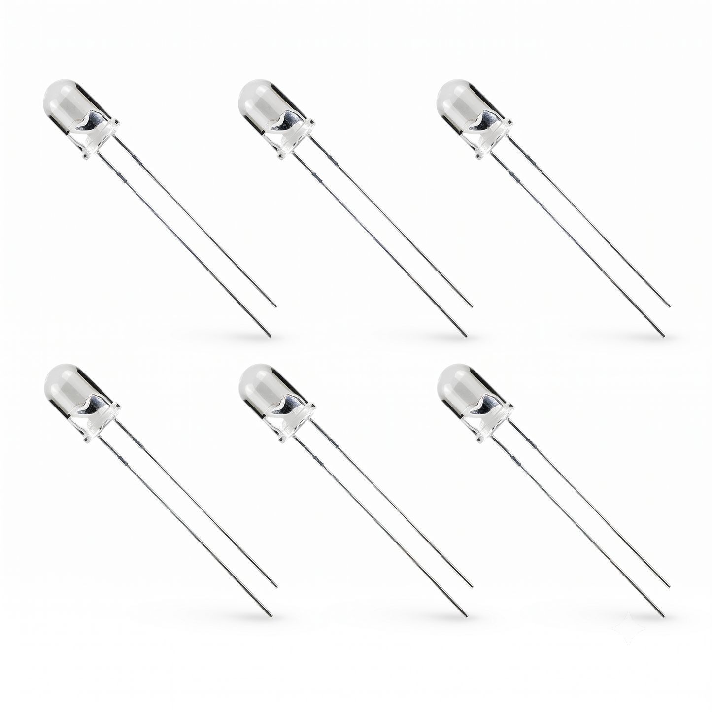 Six standard through-hole LEDs arranged in two horizontal rows of three against a plain white background. Each LED has a clear, cylindrical epoxy capsule with a domed top, revealing the internal anode and cathode structures. Two long, thin silver metal leads extend diagonally downward and to the right from the base of each capsule. Subtle shadows are cast beneath the tip of each lead, giving the image a clean, product-catalog style.