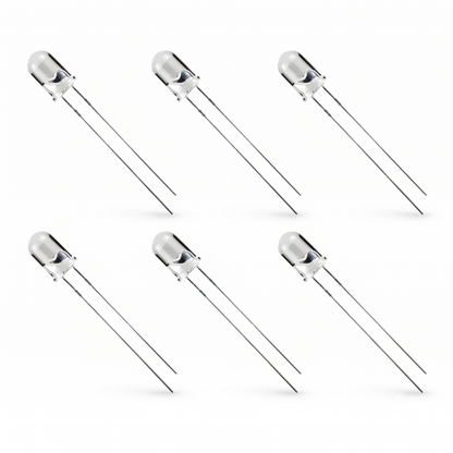 Six standard through-hole LEDs arranged in two horizontal rows of three against a plain white background. Each LED has a clear, cylindrical epoxy capsule with a domed top, revealing the internal anode and cathode structures. Two long, thin silver metal leads extend diagonally downward and to the right from the base of each capsule. Subtle shadows are cast beneath the tip of each lead, giving the image a clean, product-catalog style.