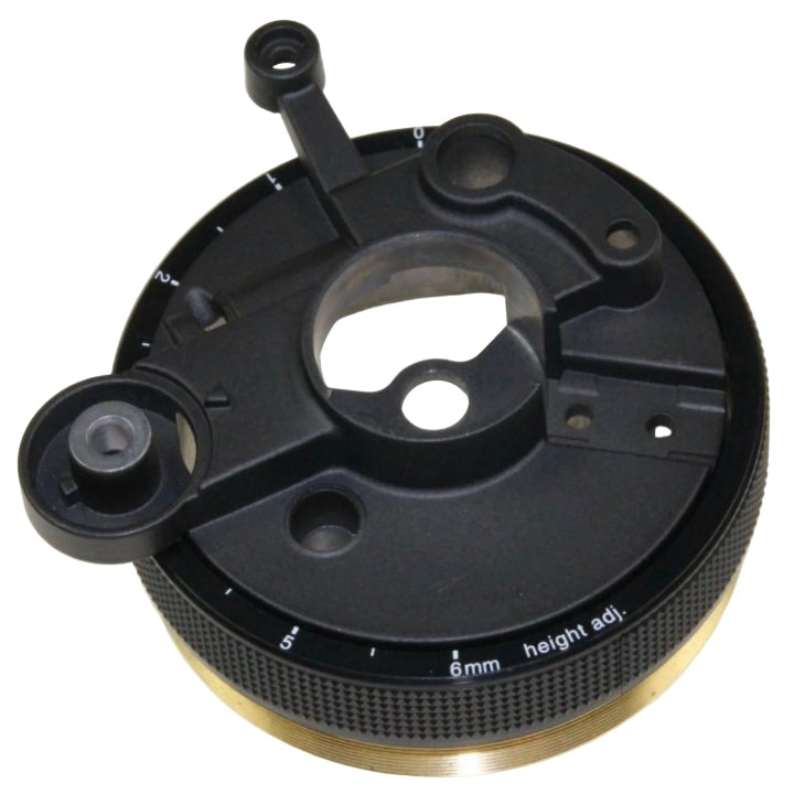 A high-angle studio shot of a Technics RFKN1200MK2B tonearm base assembly against a white background. The component features a circular black matte top with various mounting points and a central opening for a tonearm. A knurled black adjustment ring surrounds the base, featuring white printed markings for height adjustment from 0 to 6mm. The very bottom of the unit reveals a thick, threaded gold-coloured brass ring used for installation.