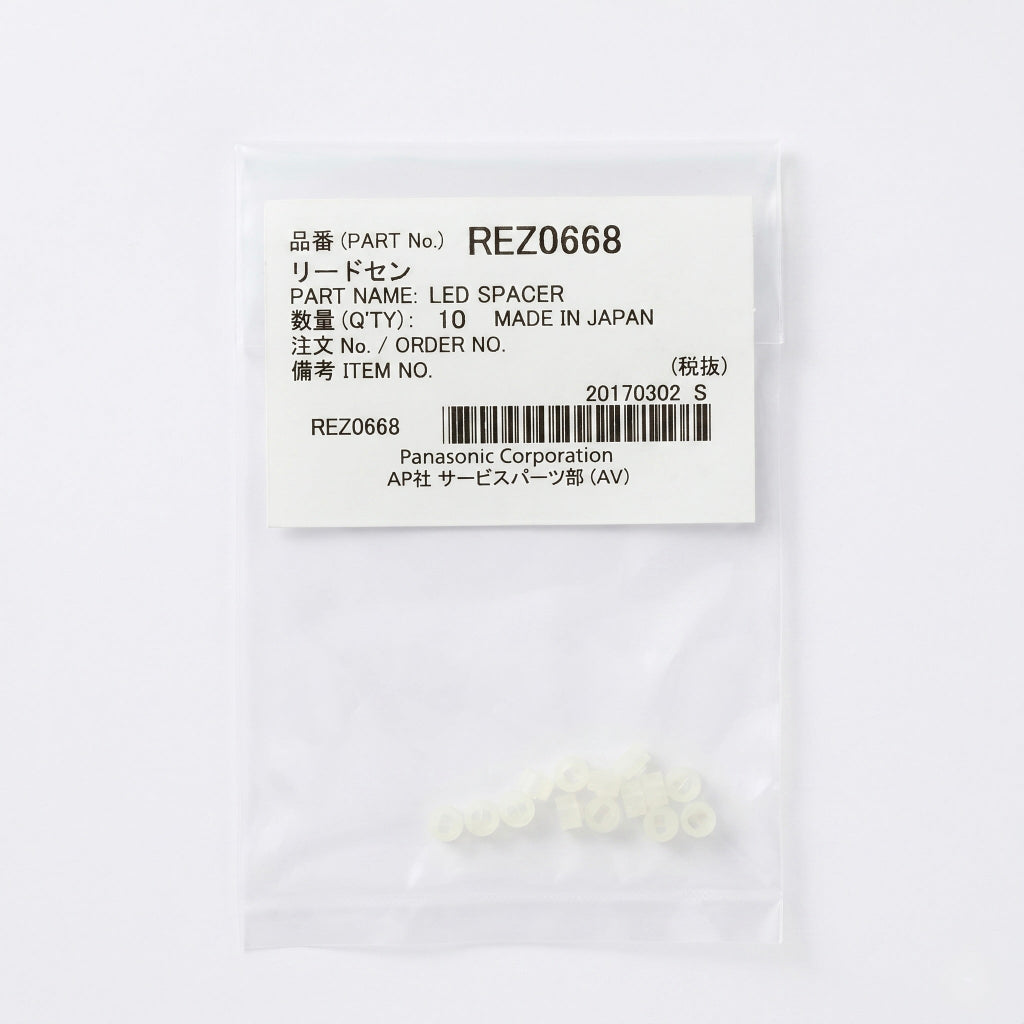 lear plastic bag containing 10 small, translucent off-white LED spacers gathered at the bottom. The top portion of the bag features a white manufacturer label with black text displaying 'PART No. REZ0668', 'PART NAME: LED SPACER', 'QTY: 10', 'MADE IN JAPAN', and 'Panasonic Corporation' alongside a barcode. The item is centered against a clean, solid white background.
