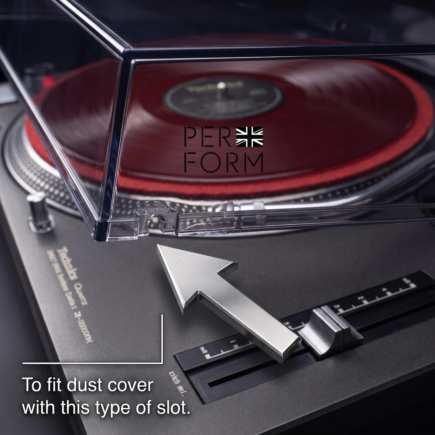 Close-up of a turntable dust cover installation area with a clear rectangular dust cover partially lifted over a red vinyl record. White text at the bottom reads, 'To fit dust cover with this type of slot.
