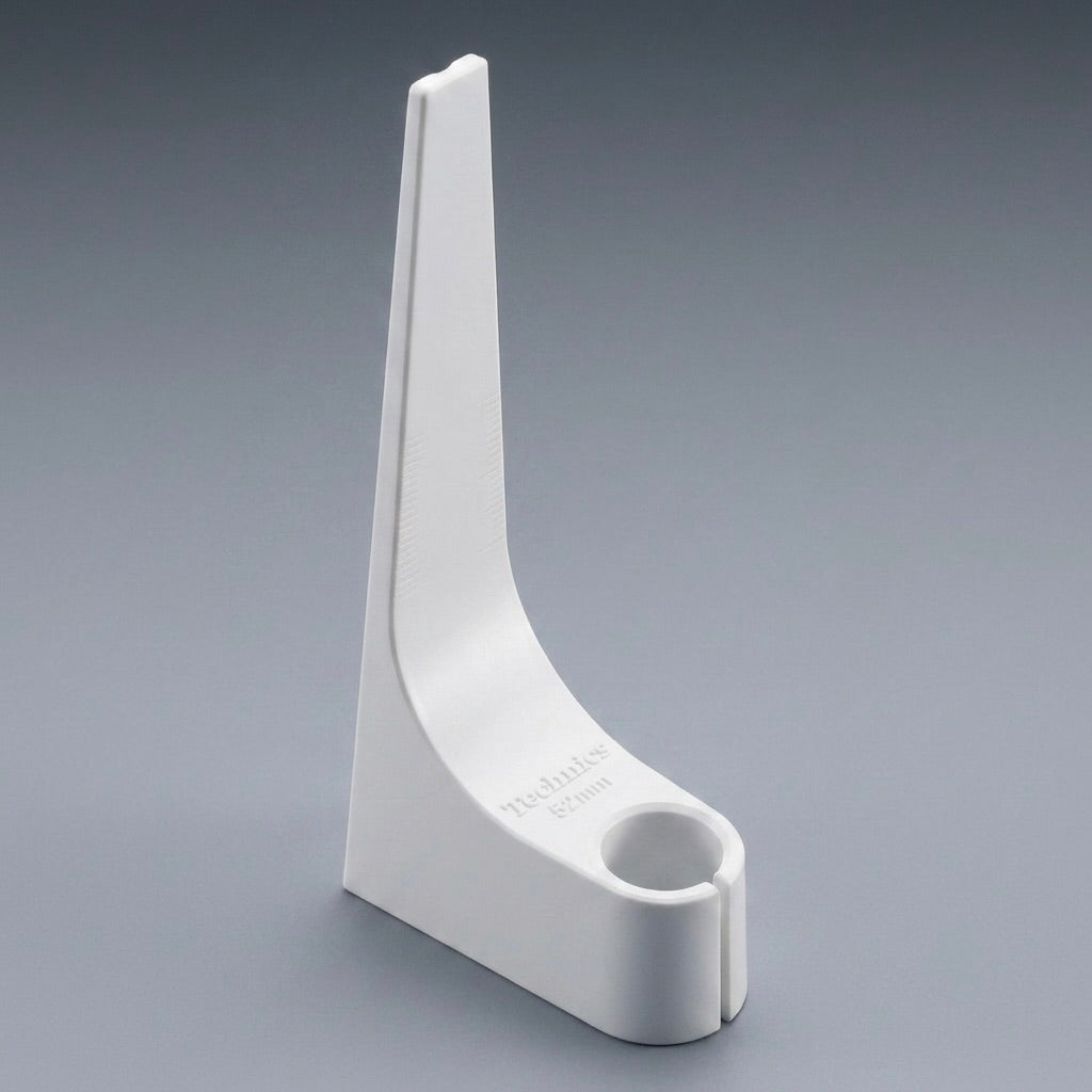 A high-definition product photograph of a white Technics overhang gauge, a vinyl turntable accessory used for cartridge alignment. The L-shaped plastic tool stands vertically on a smooth, solid grey background, showcasing its clean lines and minimalist design. The base of the gauge features the embossed text "Technics 52mm" and holds a cylindrical opening designed for a turntable headshell. Subtle, faint measurement hash marks are visible along its inner curved slope.