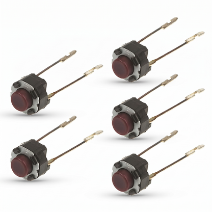 Clean studio shot against a seamless white background showing five identical electronic component switches arranged in two vertical rows. Each component is a small tactile switch featuring a circular, dark red or maroon button plunger housed in a black and silver metal casing. Extending from the rear of each switch are two long, thin metallic solder terminals with notched tips, casting soft drop shadows beneath them.