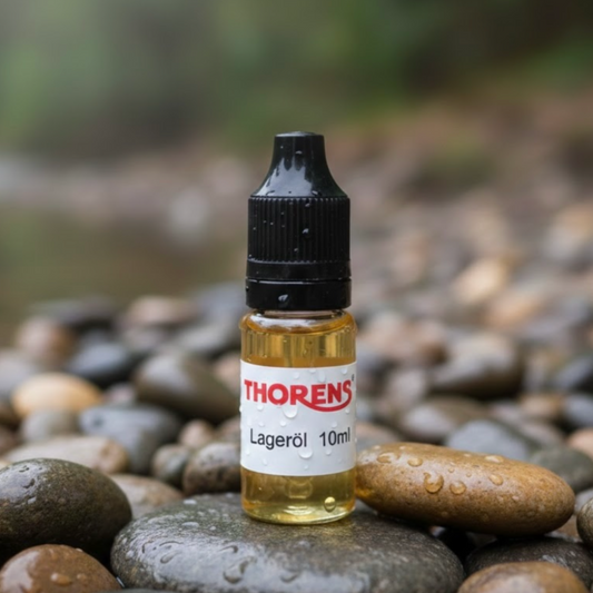 Bottle of Thorens Lageröl 10ml on pebbles with a blurred natural background