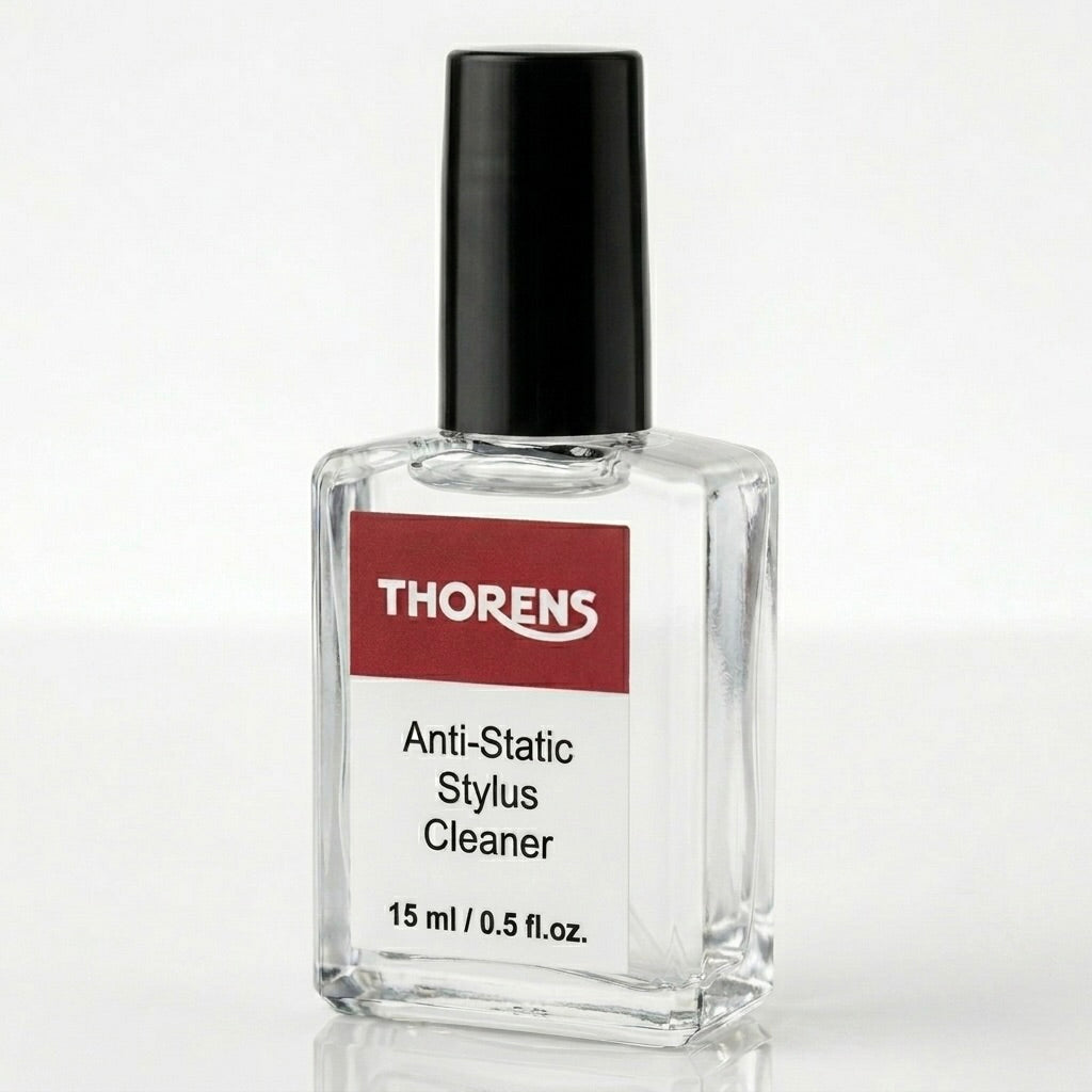 A square, clear glass bottle of Thorens Anti-Static Stylus Cleaner ($15\text{ ml } / \text{ }0.5\text{ fl.oz.}$) sitting on a reflective white surface against a clean, light grey background. The bottle has a black screw-top cap and features a white label with a distinctive red top banner displaying the white "THORENS" logo, followed by the text "Anti-Static Stylus Cleaner" in black.