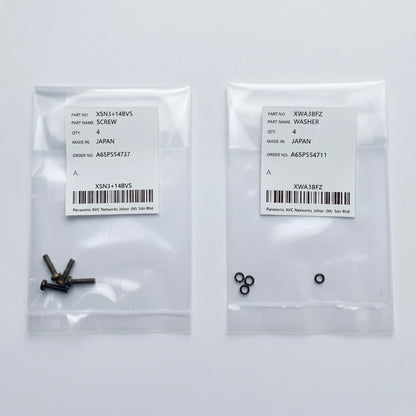 Two clear plastic parts bags side-by-side on a white surface. The left bag contains four small dark metal screws with a white label marked part number XSN3+14BVS. The right bag contains four small black locking washers with a white label marked part number XWA3BFZ. Both labels indicate they are genuine Panasonic parts made in Japan.