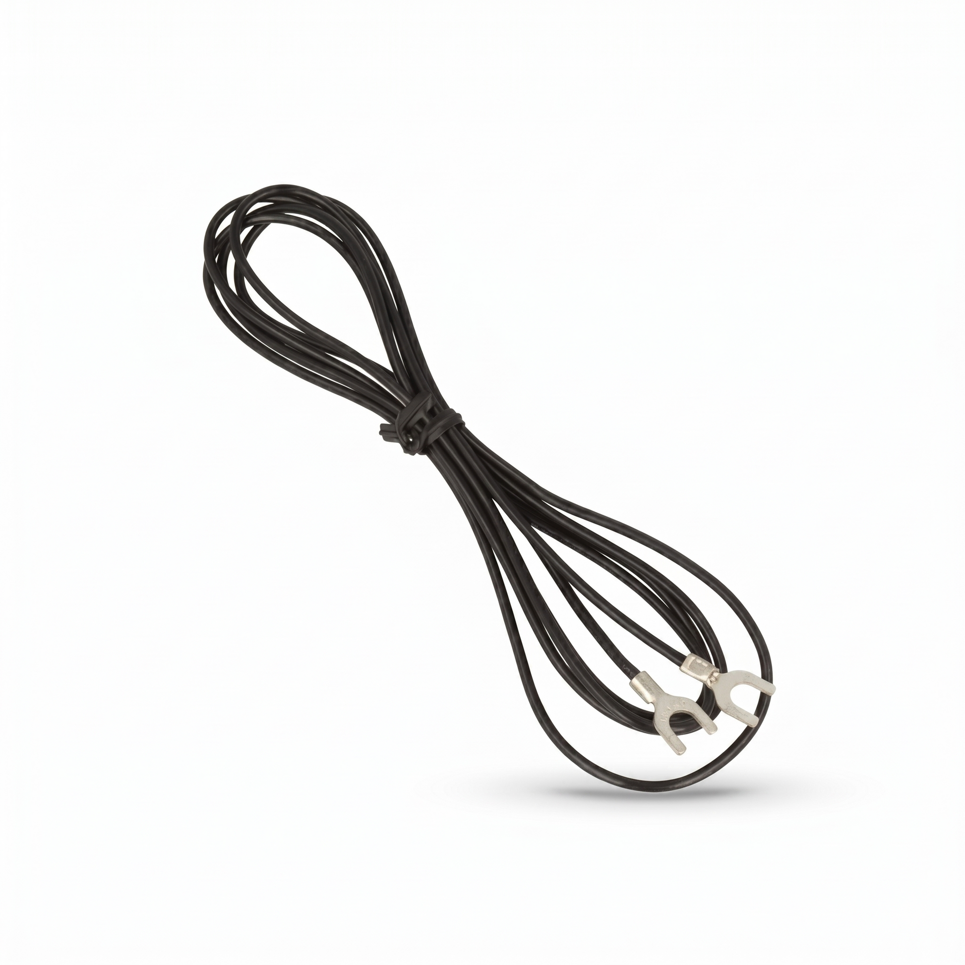 A product shot from Yamaha_GT-5000 showing a thin black ground wire bundled in a loose figure-eight loop against a plain white background. The center of the bundle is secured with a small black twist tie. The two ends of the cable extend out, each terminated with a silver spade-connector (u-shaped terminal fork). A soft, subtle shadow is cast underneath the wire loops on the lower right.