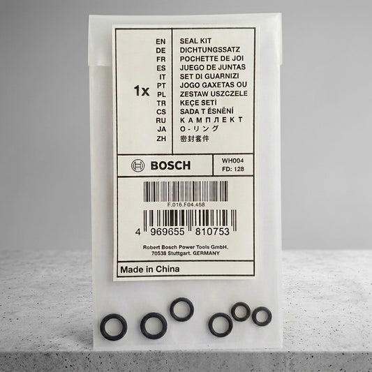 Bosch seal kit in its original white packaging box, with several black rubber O-rings arranged in a row in front of the box on a light gray surface.