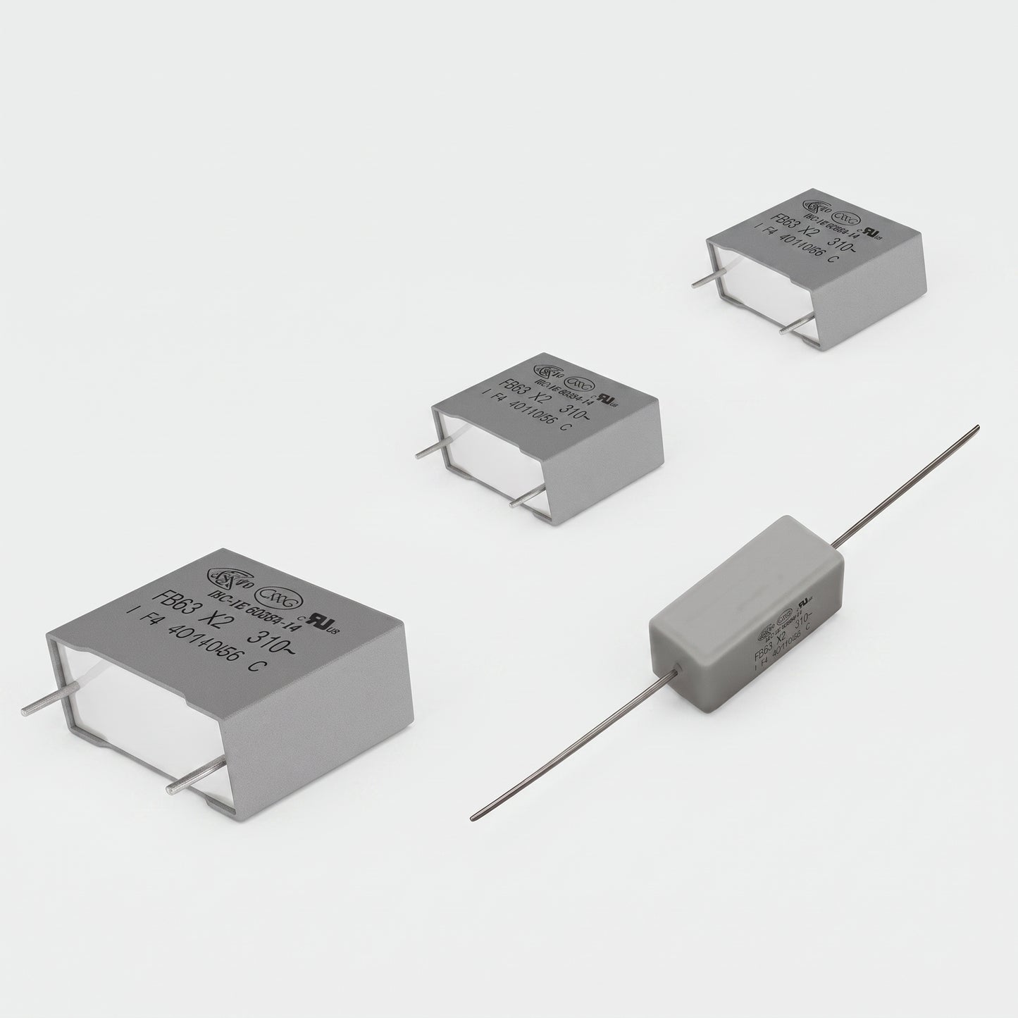 Dual CS505 turntable motor PCB repair kit featuring three grey X2 class safety capacitors and one rectangular flame-retardant resistor with wire leads, isolated on a white background.