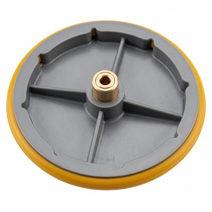 A circular gray plastic wheel or disc with a yellow outer rim and a brass-colored center post, shown on a plain white background.