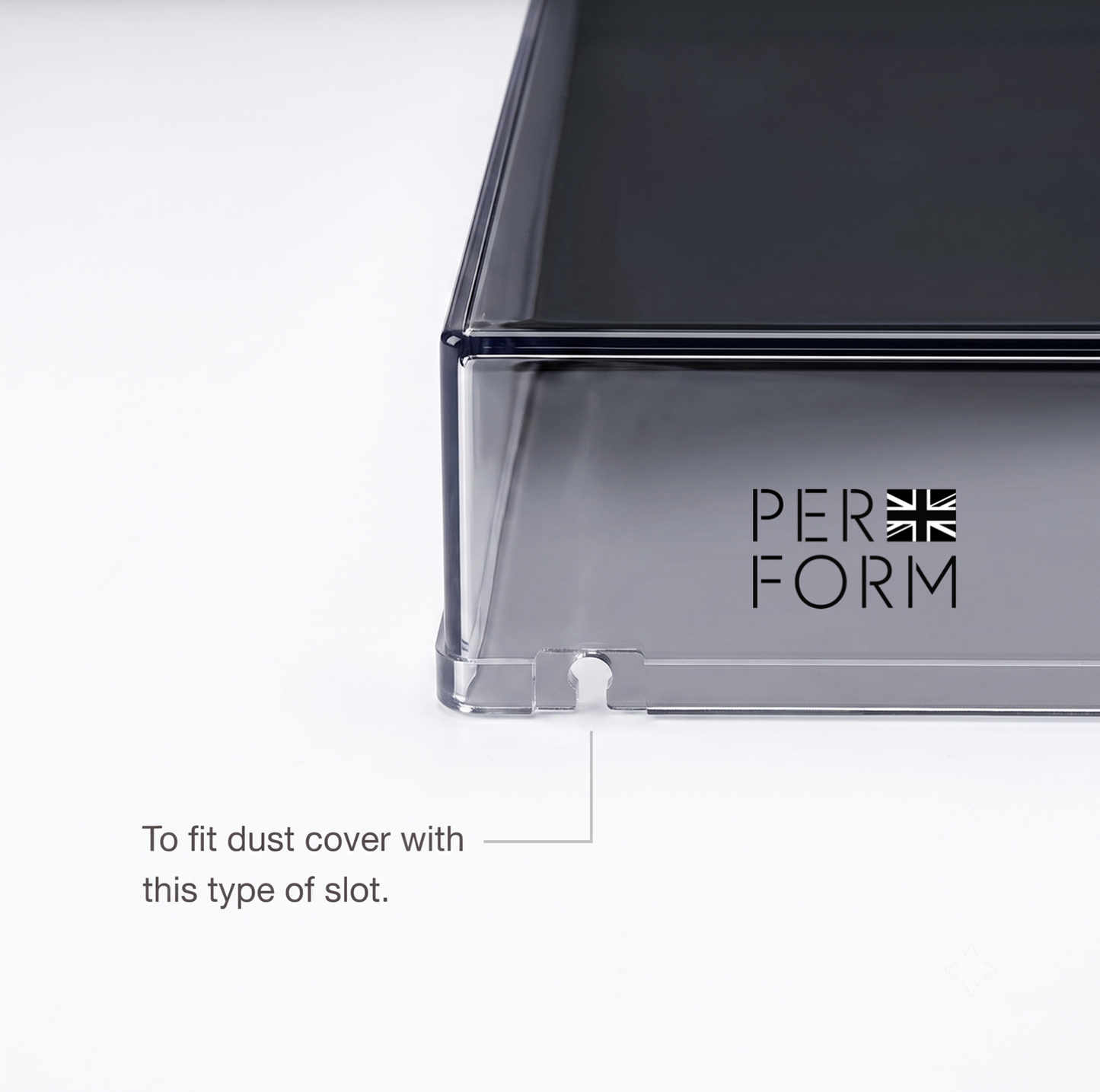 Close-up of a dark gray rectangular product with a transparent lower section and the visible brand name PERFORM on the side, plus a callout note explaining a slot for a dust cover.