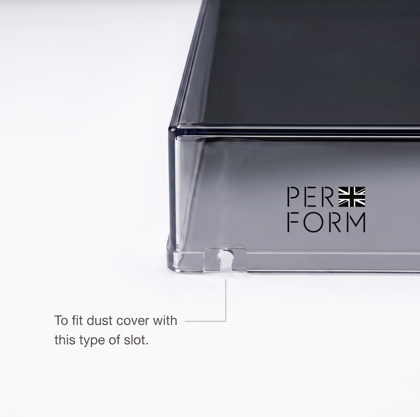 Close-up of a dark gray rectangular product with a transparent lower section and the visible brand name PERFORM on the side, plus a callout note explaining a slot for a dust cover.
