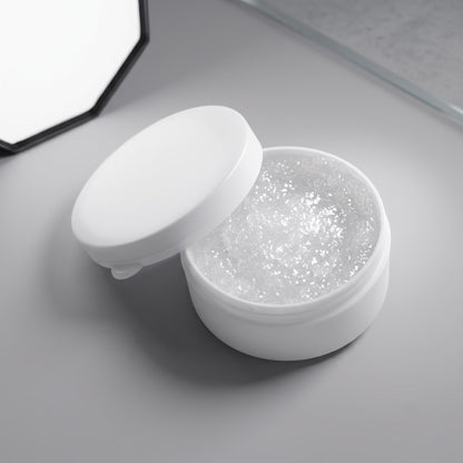 An open white Technics jar filled with a clear grease, shown on a light grey surface with a mirror partially visible in the background.